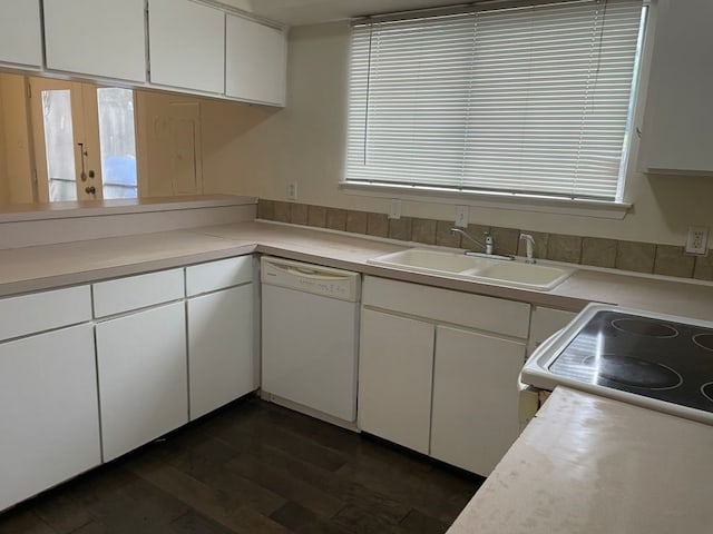 kitchen featuring a sink, light countertops, white cabinets, and white appliances