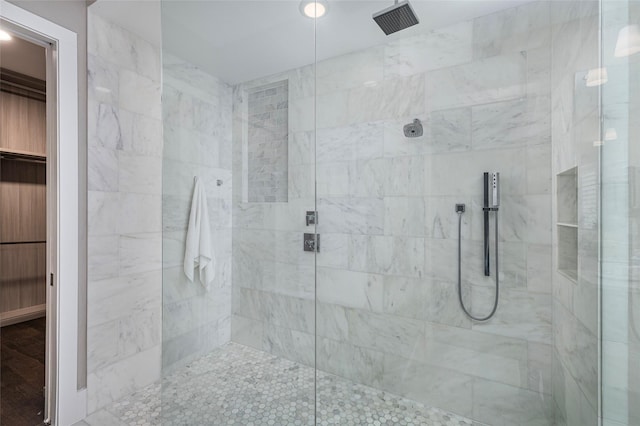 bathroom with a tile shower