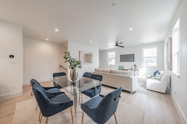 dining space featuring recessed lighting, a ceiling fan, baseboards, and light wood-type flooring
