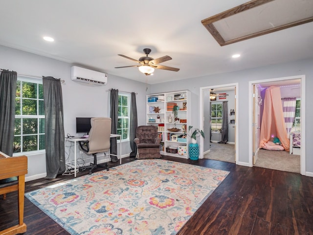 office featuring recessed lighting, a wall mounted air conditioner, baseboards, and ceiling fan