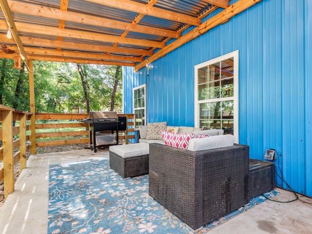 view of patio with grilling area, fence, and an outdoor hangout area