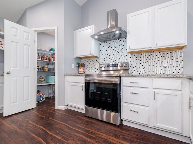 kitchen with wall chimney range hood, stainless steel range with electric cooktop, dark wood-style flooring, and tasteful backsplash