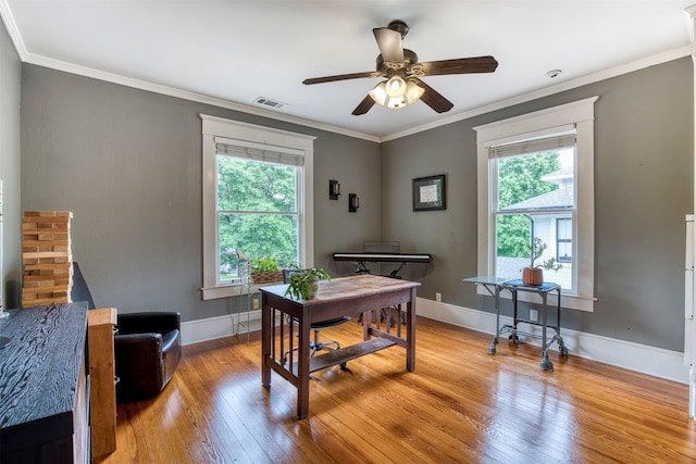 office with plenty of natural light, a ceiling fan, hardwood / wood-style flooring, and visible vents