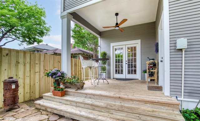 deck featuring a ceiling fan, fence, and french doors