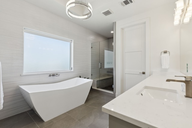 bathroom with a sink, tile patterned floors, and visible vents
