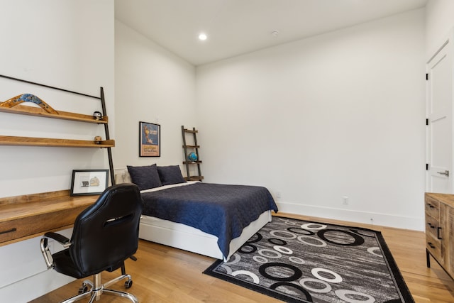 bedroom featuring recessed lighting, baseboards, and light wood finished floors