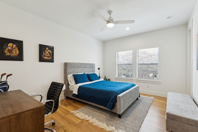 bedroom with recessed lighting, a ceiling fan, light wood finished floors, and baseboards