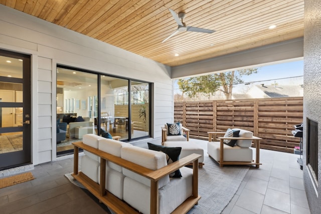 view of patio / terrace featuring a ceiling fan, fence, and an outdoor hangout area
