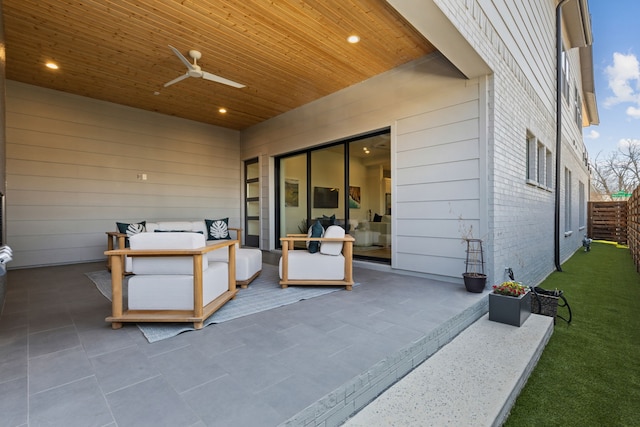 exterior space with fence, outdoor lounge area, and a ceiling fan