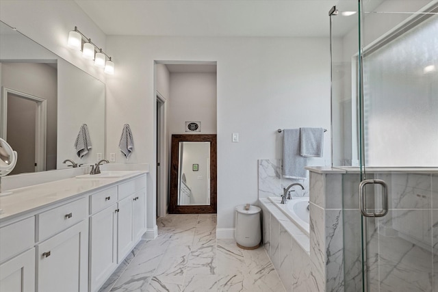 full bath featuring vanity, marble finish floor, baseboards, a bath, and a stall shower