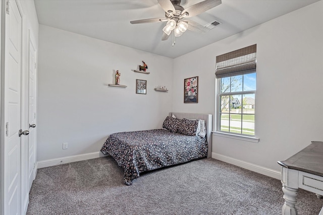 bedroom featuring carpet flooring, a ceiling fan, baseboards, and visible vents