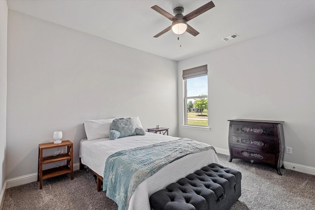 carpeted bedroom featuring baseboards, ceiling fan, and visible vents
