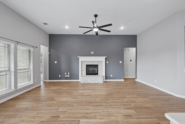 unfurnished living room featuring a ceiling fan, light wood-type flooring, visible vents, baseboards, and recessed lighting