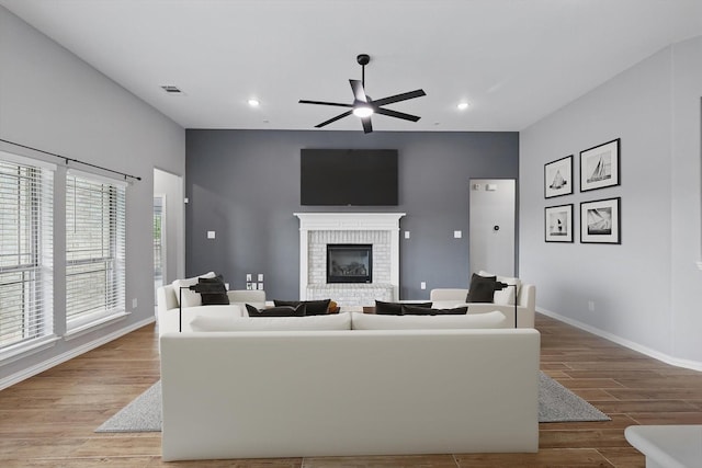 728 Lawndale St, Celina, TX 75009 - living area featuring a ceiling fan, wood finished floors, a fireplace, baseboards, and recessed lighting