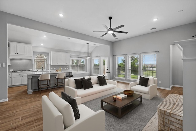 728 Lawndale St, Celina, TX 75009 - living area featuring ceiling fan, vaulted ceiling, wood finished floors, recessed lighting, and baseboards