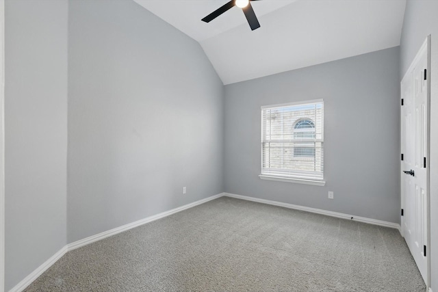 unfurnished bedroom with baseboards, carpet floors, and vaulted ceiling
