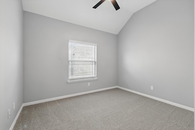 unfurnished room with vaulted ceiling, ceiling fan, carpet floors, and baseboards