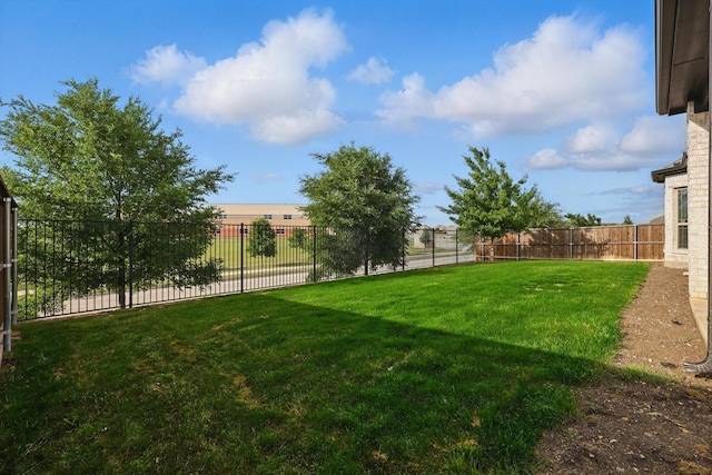 view of yard with a fenced backyard
