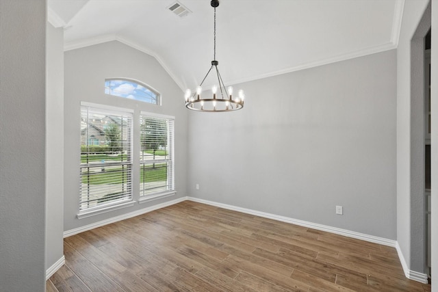 unfurnished dining area featuring an inviting chandelier, wood finished floors, visible vents, baseboards, and lofted ceiling
