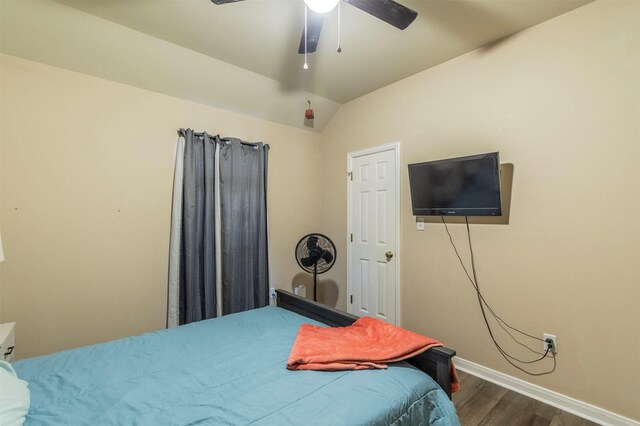 bedroom with vaulted ceiling, baseboards, a ceiling fan, and dark wood finished floors