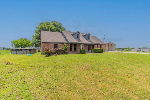 cape cod house with brick siding, a shingled roof, and a front lawn