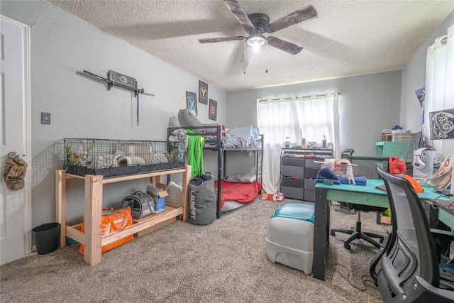 bedroom with a ceiling fan, carpet flooring, and a textured ceiling