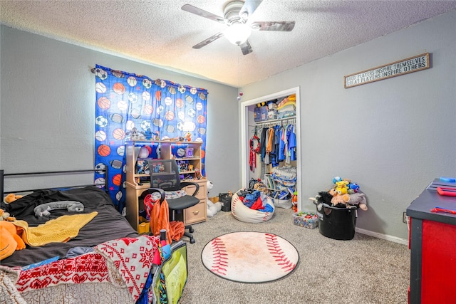 bedroom featuring ceiling fan, a textured ceiling, a closet, a textured wall, and carpet flooring