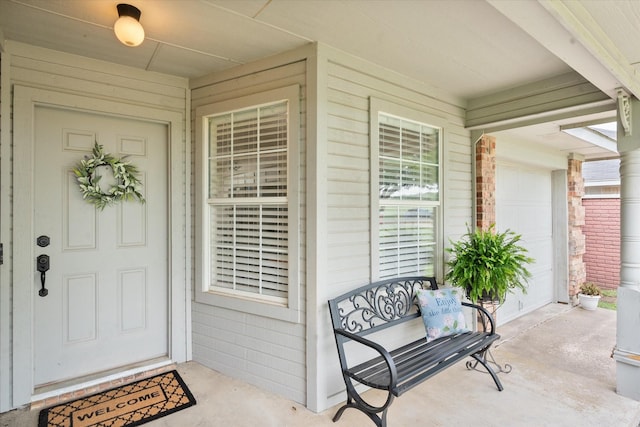 entrance to property featuring covered porch