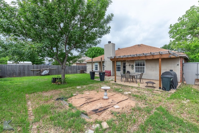 rear view of house with a pergola, a patio, a fenced backyard, a chimney, and a lawn