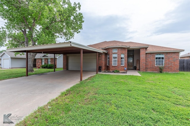 ranch-style house featuring an attached garage, a front yard, and brick siding