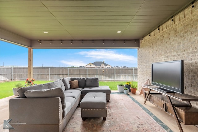 view of patio featuring outdoor lounge area and a fenced backyard