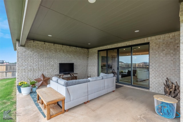 view of patio / terrace with fence and an outdoor hangout area