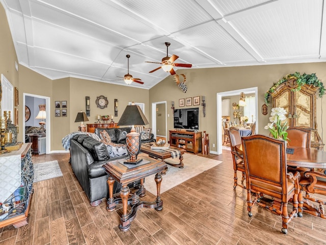 living room with baseboards, ceiling fan, coffered ceiling, and wood finished floors