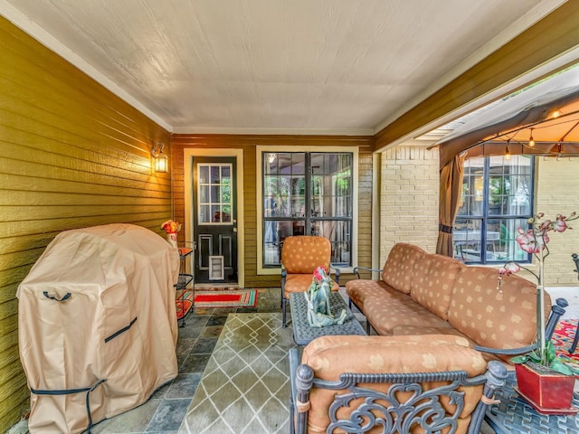 sunroom / solarium featuring a healthy amount of sunlight