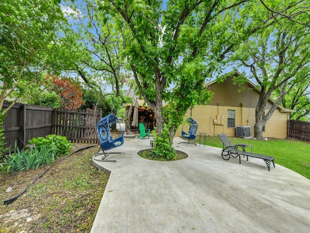 view of patio featuring central AC unit and a fenced backyard