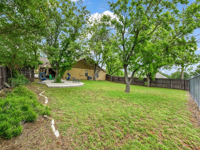 view of yard featuring a patio and a fenced backyard