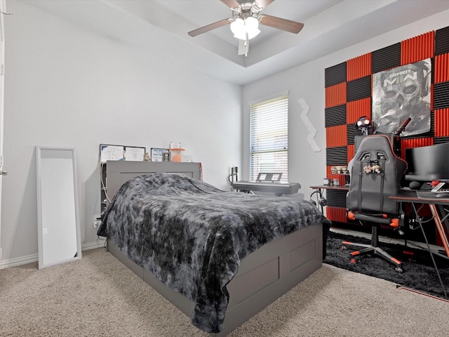 carpeted bedroom with baseboards and a ceiling fan