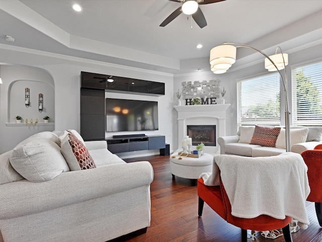 living area featuring recessed lighting, a raised ceiling, a ceiling fan, and dark wood-style flooring