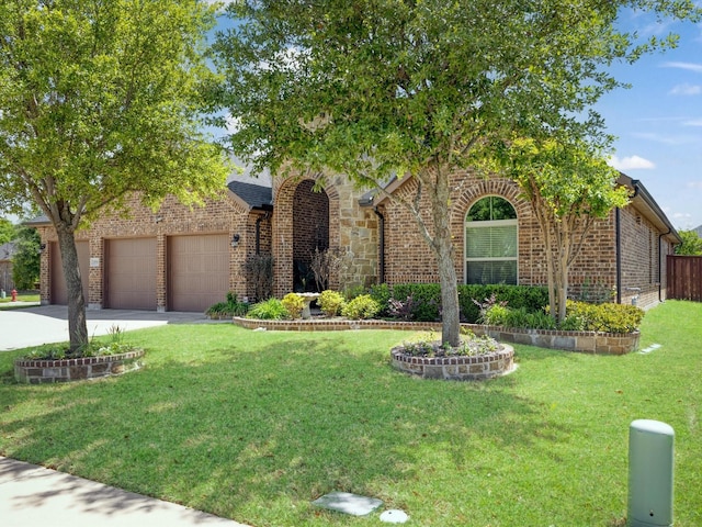 obstructed view of property with a garage, brick siding, fence, a front lawn, and concrete driveway