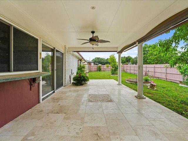 view of patio / terrace with ceiling fan and a fenced backyard