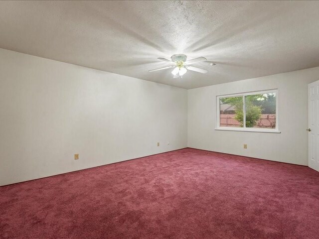 unfurnished room with carpet floors, a textured ceiling, and ceiling fan