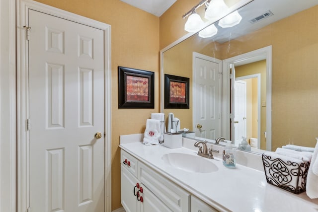 bathroom featuring vanity and visible vents