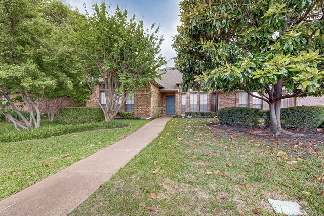1413 Chesterton Dr, Richardson, TX 75080 - property entrance featuring brick siding