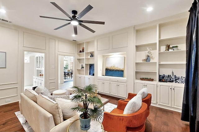 living room with a ceiling fan, dark wood-style floors, built in features, and recessed lighting