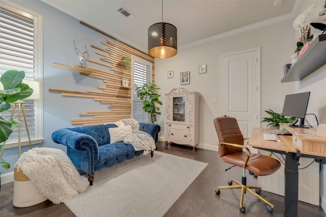 office area featuring baseboards, visible vents, ornamental molding, and wood finished floors