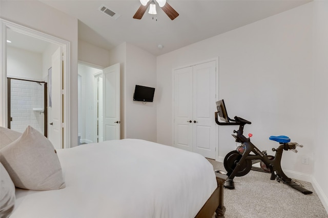 carpeted bedroom with a ceiling fan, visible vents, baseboards, a closet, and connected bathroom