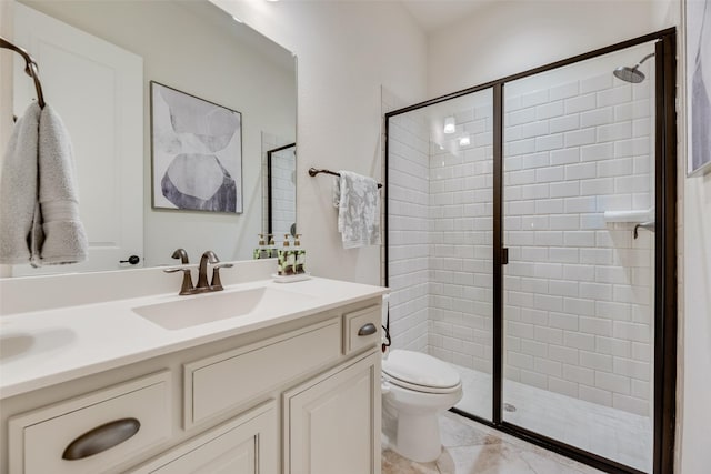 full bathroom featuring toilet, a shower stall, and vanity