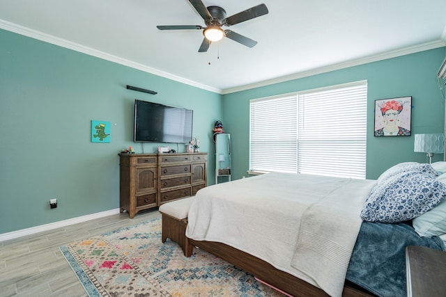 bedroom with crown molding, baseboards, ceiling fan, and wood finished floors