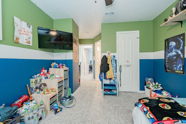 bedroom with visible vents, a ceiling fan, carpet, and a closet