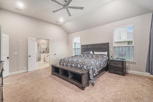 bedroom with carpet, lofted ceiling, baseboards, connected bathroom, and ceiling fan
